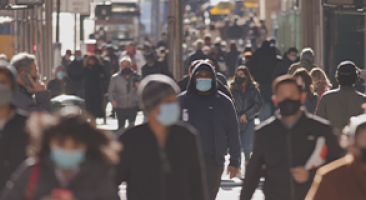 People walking with masks on street