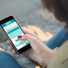 Woman filling online survey on her smartphone
